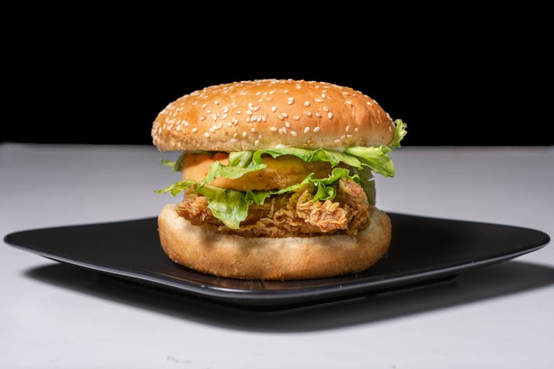 towering dave's hot chicken burger with crispy patty