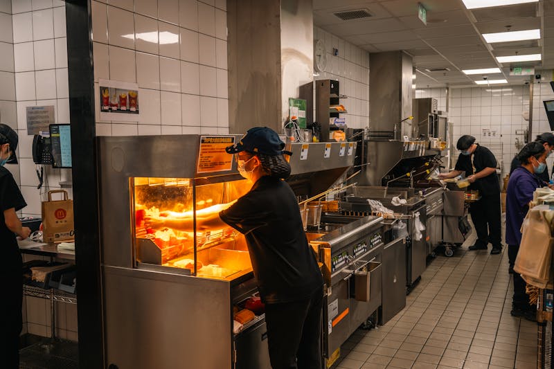 Dave's hot chicken head chef cooking in kitchen